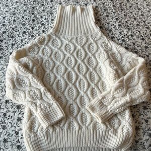 Turtleneck chunky white cableknit sweater